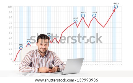 Young businessman calculating stock market with rising graph in the background
