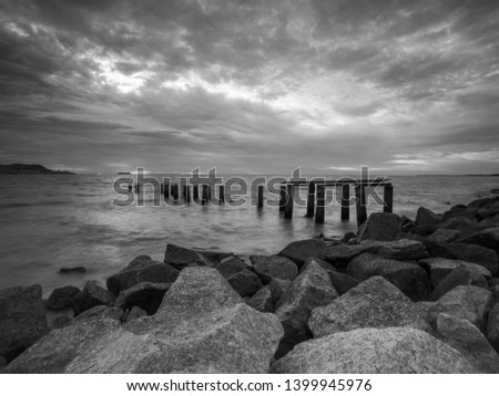 Fine art image in black & white of abandon jetty at Penang. Malaysia. Soft focus due to long exposure