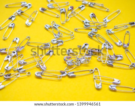 Lots of safety pins. Team concept