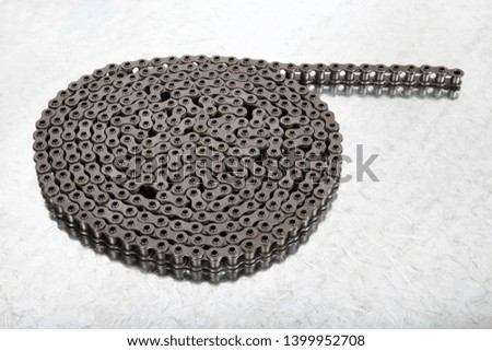 new, metal chains on white ground
