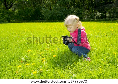 Girl photographs on nature