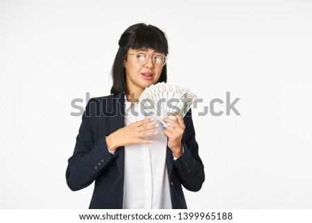    business woman counts money on a light background                            