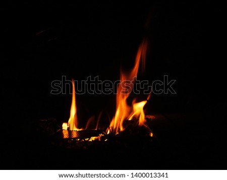 Many flames of red flames on a black background