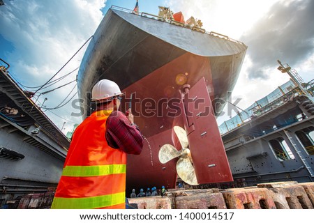 port controller, harbor master in command on the terminal port for safety and control security during the operation of ship in port Royalty-Free Stock Photo #1400014517