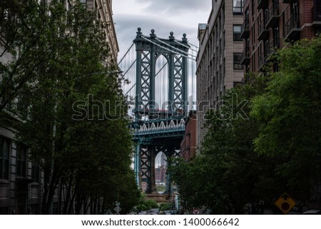 View of one of the towers of the Manhattan Bridge from the streets of the DUMBO district, Brooklyn, NYC 