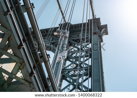 View of one of the towers of the Manhattan Bridge from the streets of the DUMBO district, Brooklyn, NYC 