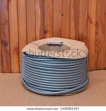 Photo on a white background of a metal sleeve box cable channel for wires for mounting electricians. Perfect for filling the catalog of a modern iniernet store on the site. Studio photo.