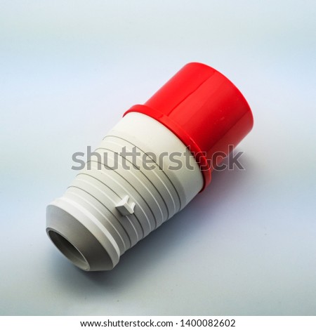 The photo on a white background electrical plug and socket for connecting wires for mounting electrics. Perfect for filling the catalog of a modern iniernet store on the site. Studio photo.