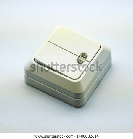 Picture on a white background electrical switch for mounting electrics in the wall. Perfect for filling the catalog of a modern iniernet store on the site. Studio photo.