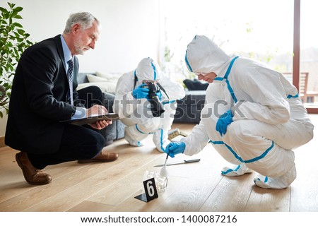Police with forensics at forensics after raid at the scene Royalty-Free Stock Photo #1400087216