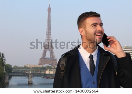 Businessman calling by phone from Paris