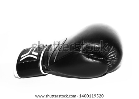 the black glove is a side view on white background