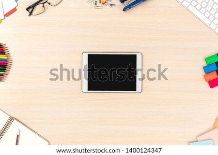 Wooden desk workplace digital tablet screen up top view nobody