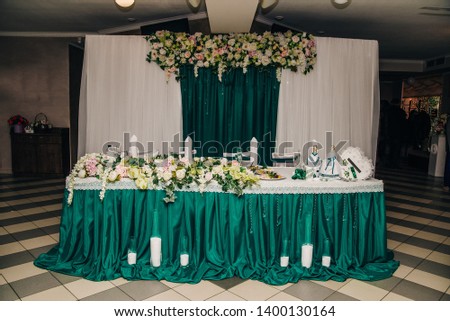 decor on the wedding table with a green screen in the background