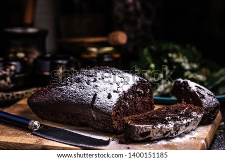Pieces of chocolate cake on a wooden board. Restaurant food. Powdered icing. Chocolate Brownie.