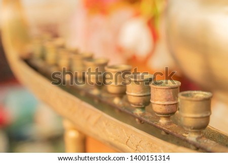 Brass candle holder on a blurred background