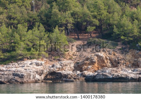 rocky shoreline view from a boat