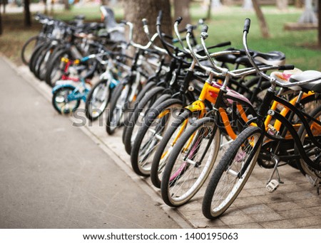 Bicycle parking in a public park. Lot of bicycle in a park.