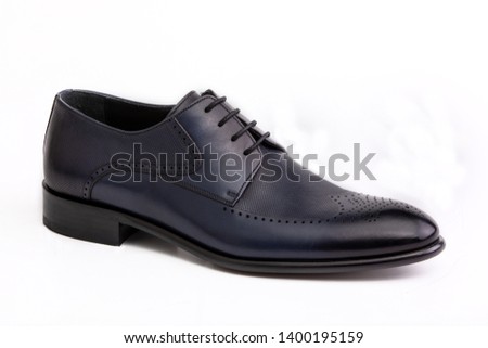 Male blue leather shoe on white background, isolated product, comfortable footwear. Royalty-Free Stock Photo #1400195159