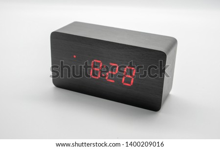Digital rectangle wooden clock isolated on white background.