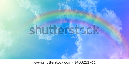 
The soft white clouds and pastel skies with rainbow curves, various colors, beautiful as a pastel background