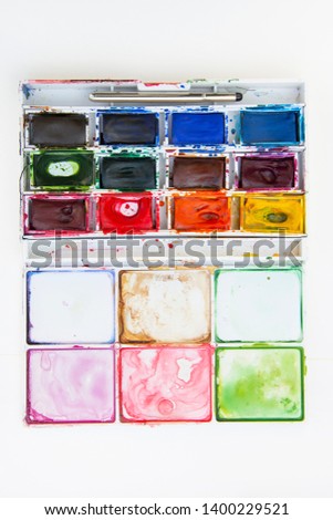 Set of watercolor paints isolated for painting closeup. Selective focus. Art, creative background with copy space
