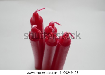 red candles on isolated white background