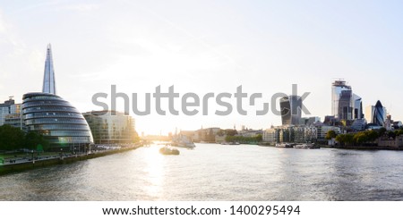 London city skyline panorama across River Thames at sunset