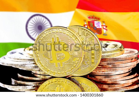 Concept for investors in cryptocurrency and Blockchain technology in the India and Spain. Bitcoins on the background of the flag India and Spain.