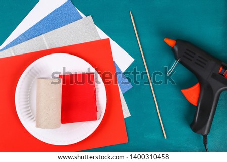 Diy 4th July petard toilet sleeve, paper, cardboard color American flag red blue white. Gift idea decor July 4, USA Independence Day. Step by step. Top view Process kid children craft. Workshop Royalty-Free Stock Photo #1400310458