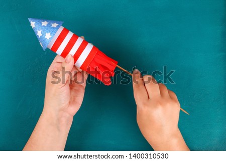 Diy 4th July petard toilet sleeve, paper, cardboard color American flag red blue white. Gift idea decor July 4, USA Independence Day. Step by step. Top view Process kid children craft. Workshop Royalty-Free Stock Photo #1400310530