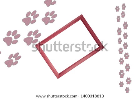 Big animal and small animal foot prints on white background with wooden frame in the center of the picture and free blank copy space