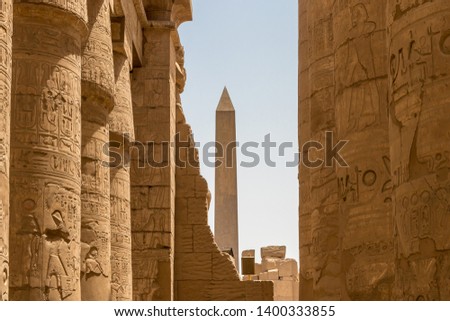 Obelisk at the centre of Karnak temple with the sandstone columns, Egypt