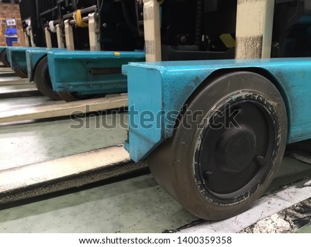 Front wheel and part of electric forklift for using in the logistics warehouse.