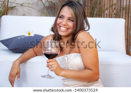 emotional latin girl with a glass of wine