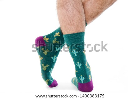 Back view of male legs in colorful socks. Isolated on white background. Clipping paths included.