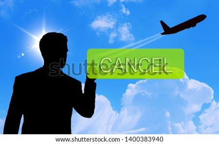 man pointing finger on cancel button, cancelled flight concept or cancelled unavailable for vacation holiday break