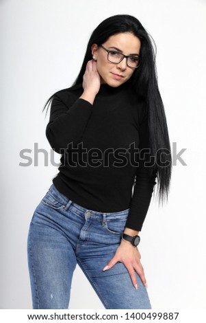 Beautiful girl with black hair posing on isolated background
