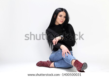 Beautiful girl with black hair posing on isolated background