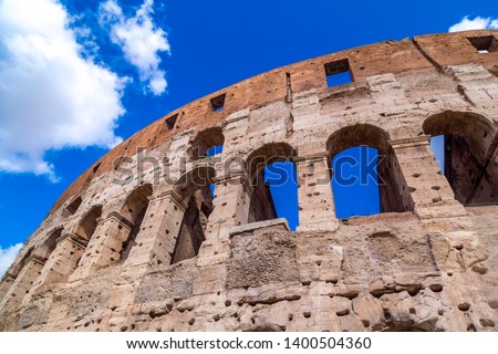 Exterior view of the ancient Roman Colosseum or Flavian Amphitheather in Rome, Italy.