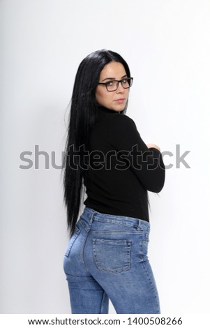 Beautiful girl with black hair posing on white background