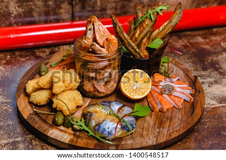 beer plate with anchovy nuggets and fish