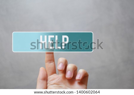 Help - finger pressing blue translucent button on virtual touchscreen interface on grey wall background. Online customer service concept.
