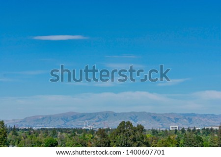 Bird eye view of Silicon Valley landscape with San Francisco Bay Area peaks of Diablo mountain range - Mountain View, California, USA - May 13, 2019