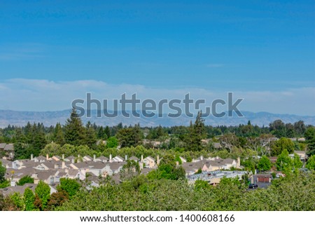 Bird eye view of Silicon Valley landscape with San Francisco Bay Area peaks of Diablo mountain range - Mountain View, California, USA - May 13, 2019