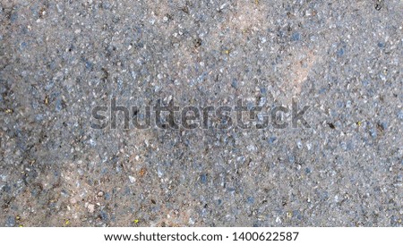 texture of old asphalt in spring time