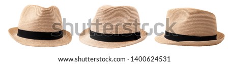 Summer and beach fashion, personal accessories and holiday head wear concept theme with multiple straw hats or fedoras with a black strap or ribbon isolated on white background with a clip path cutout Royalty-Free Stock Photo #1400624531