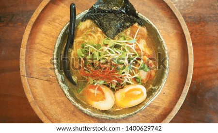 Japanese food ramen recipe with eggs, snow pea sprouts, seaweed in fish stock
