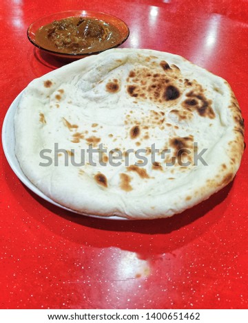 Naan Bread with lamb curry. delicious indian cuisine stock photo -image