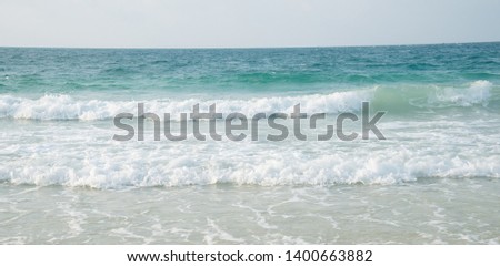 beautiful seascape panorama. Composition of nature.Sea wave with bubbles hits the sand beach wallpaper with sunlight.beach in sunset time.